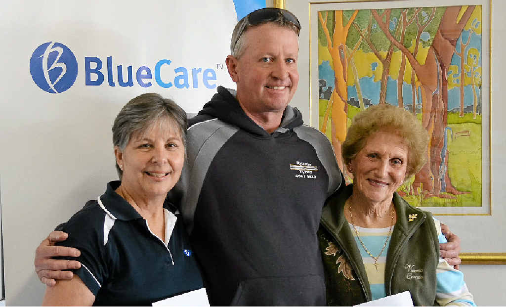 DEMENTIA DONATION: Multi service manager Sue Hoopman and Pam Eather accept generous donations from Brendan Ryan from Ryanie for Tyres.